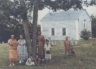 Photo of Wampanoag family in the yard of the mashpee old Meting House circa 1959.